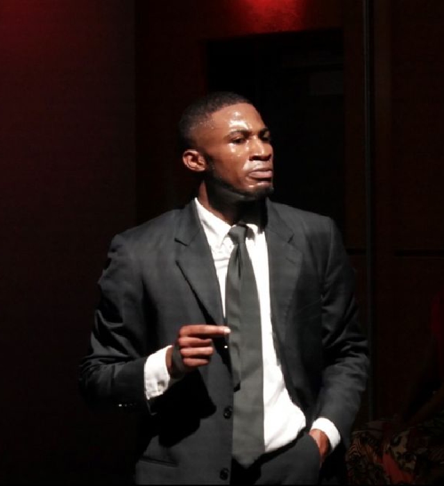 Tristan Parks stands in a suite during a performance.